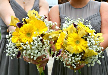 Bridesmaids' bouquets with bright yellow flowers
