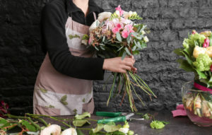 Female florist bartender at flower bar