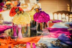 Large flower arrangements with colorful roses and butterflies